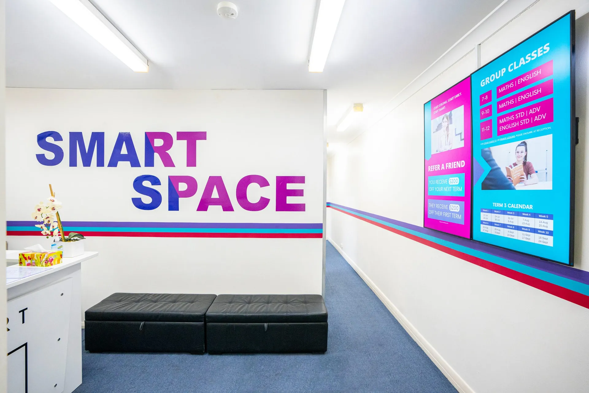 The Smart Space Tutoring reception in Rockdale, desk, SMART SPACE wall lettering and waiting area